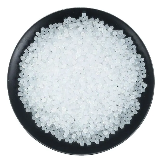 Black dish filled with white polyethylene pellets